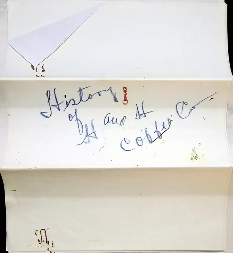 Verso: History of H and H Coffee Co — Folded blank paper inscribed in blue cursive "History of H and H Coffee Co" with a small red seal/mark; foxing spots in the corners.