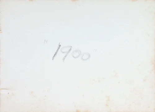 Verso marked "1900" — 1900 — Otherwise blank, lightly foxed photo verso with a single pencil notation: "1900".